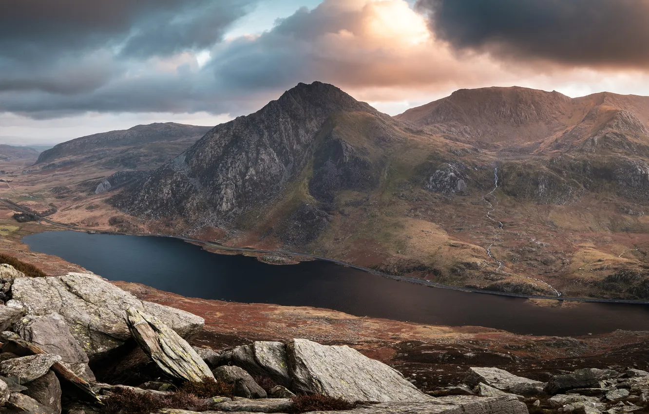 Photo wallpaper the sky, mountains, river, stones, rocks, shore, tops, view