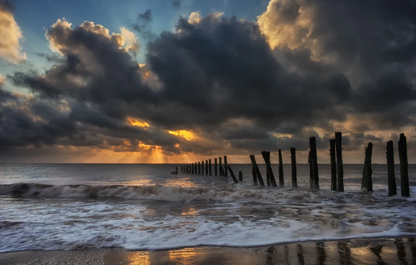 Photo wallpaper sea, wave, the sky, light, sunset, clouds, shore, posts
