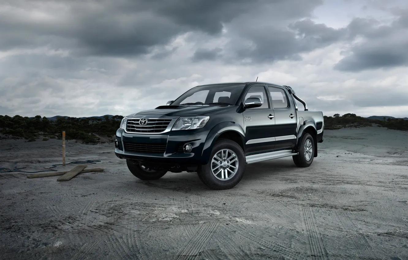 Photo wallpaper sand, traces, clouds, car, Toyota Hilux