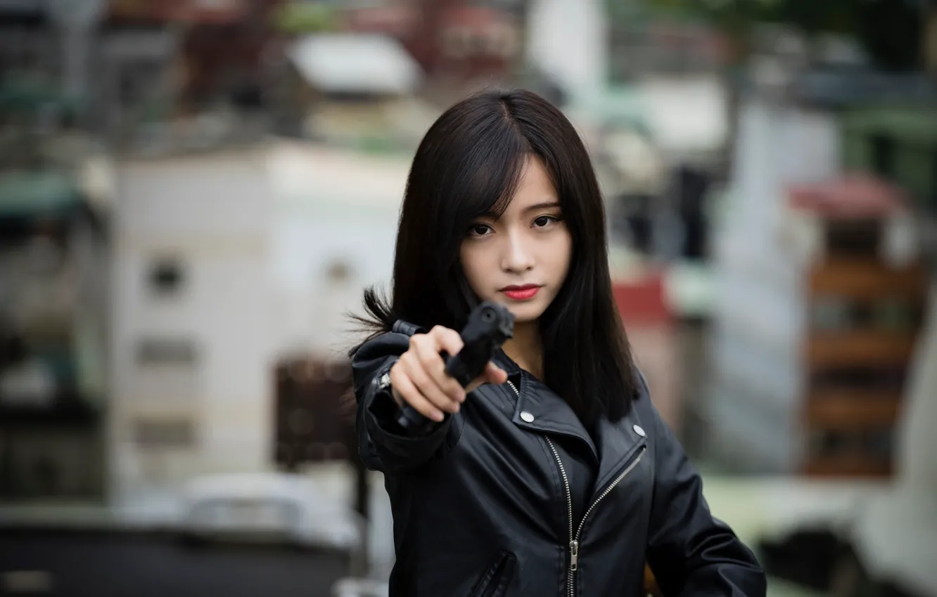 Photo wallpaper girl, face, gun, hair, brunette, East