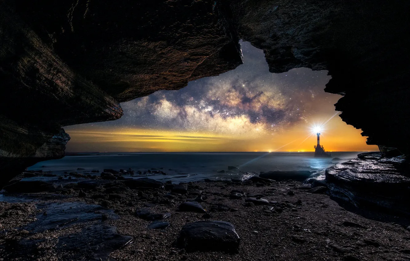 Photo wallpaper night, rocks, lighthouse, cave