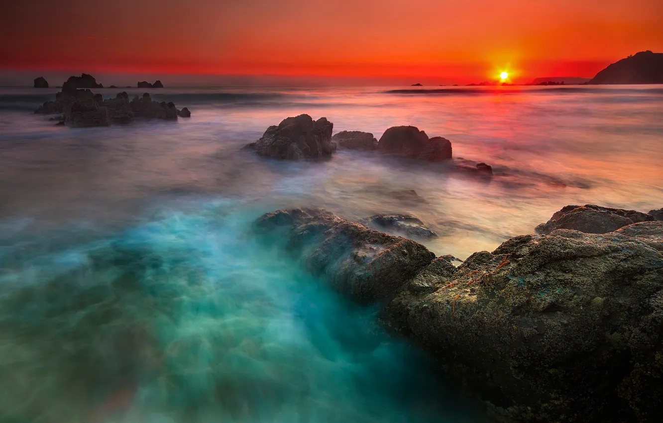 Photo wallpaper sea, the sky, the sun, sunset, stones, rocks