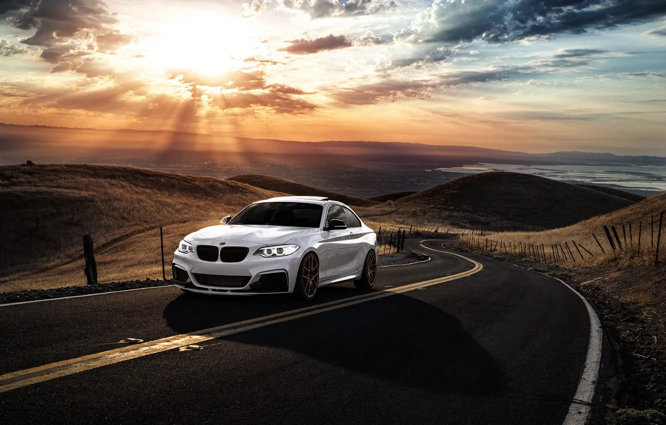 Photo wallpaper BMW, Car, Front, Sunset, Sunrise, Mountains, Road, Wheels