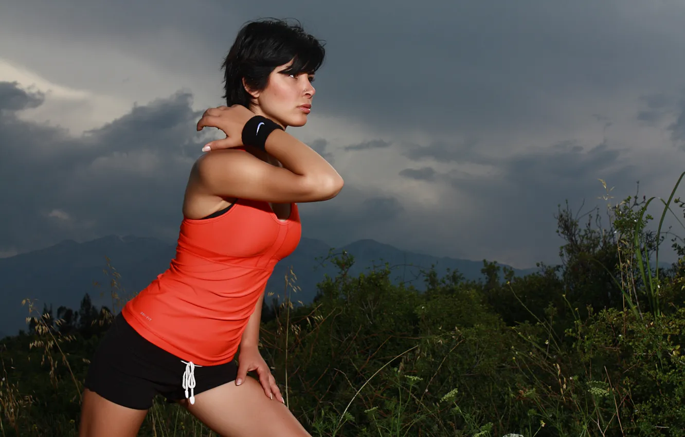 Photo wallpaper clouds, mountains, pose, movement, athlete, gesture, mountains, clouds