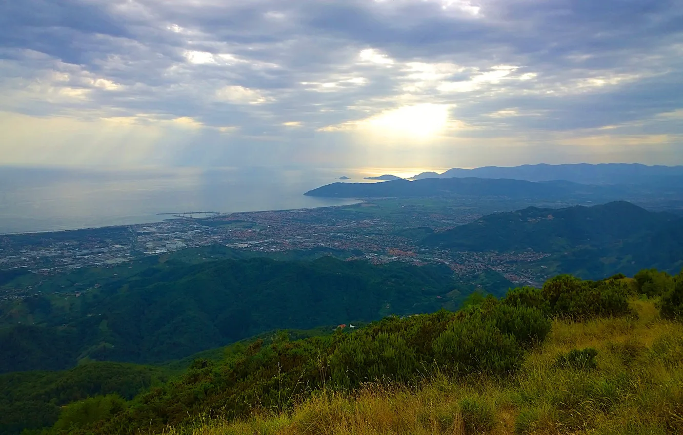 Photo wallpaper sea, forest, grass, clouds, rays, mountains, the city, Italy