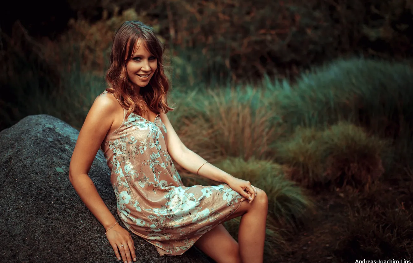 Photo wallpaper grass, look, smile, model, stone, portrait, makeup, dress