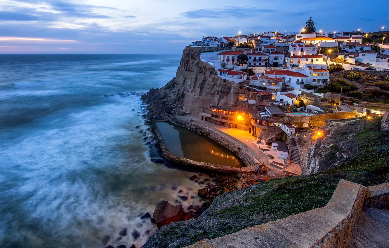 Photo wallpaper the city, the ocean, rocks, coast, home, the evening, village, lighting