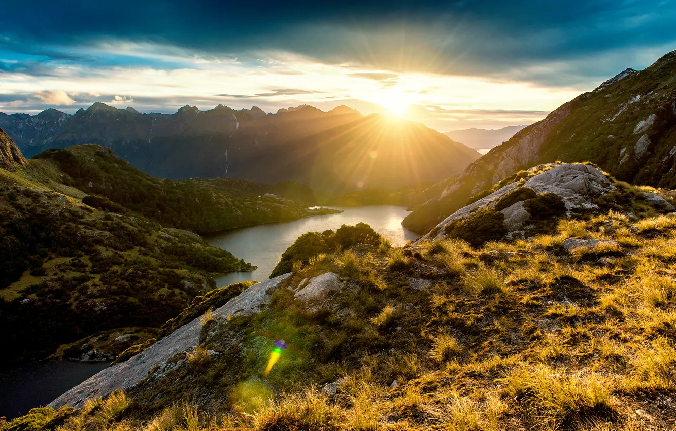 Photo wallpaper mountains, stones, rocks, New Zealand, Bay, the rays of the sun, the fjord, Fiordland
