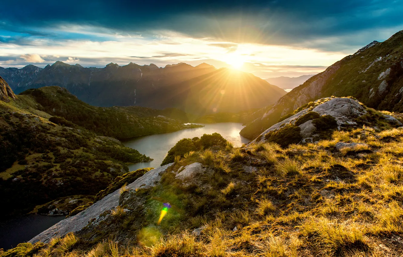 Photo wallpaper mountains, stones, rocks, New Zealand, Bay, the rays of the sun, fjords, Fiordland