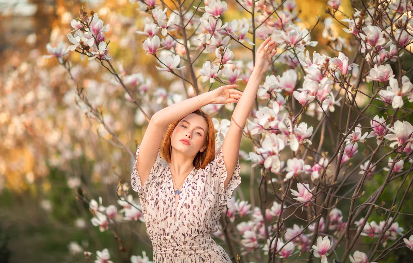 Photo wallpaper girl, branches, pose, hands, red, redhead, flowers, Magnolia