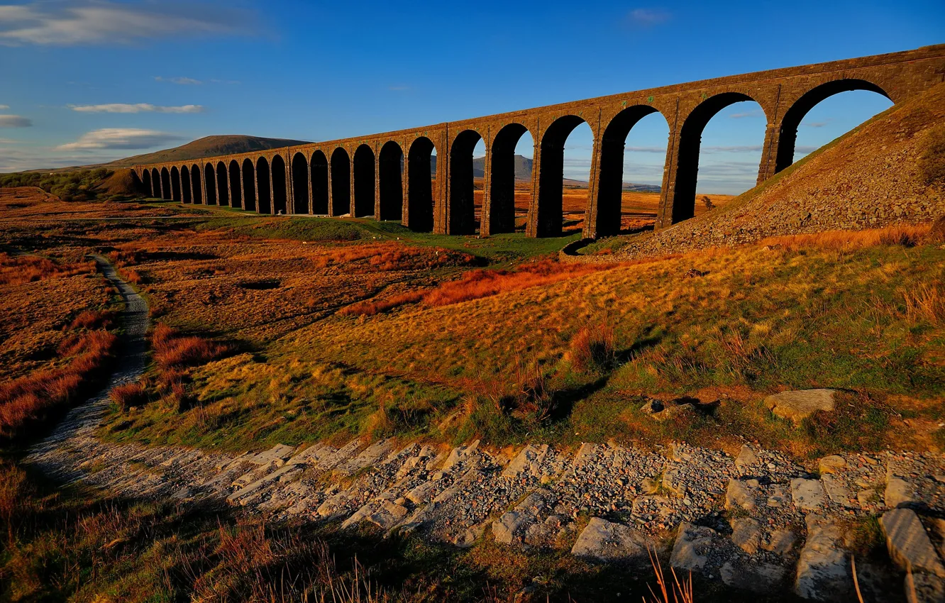 Photo wallpaper autumn, the sky, blue, bridge, blue, stones, hills, vegetation