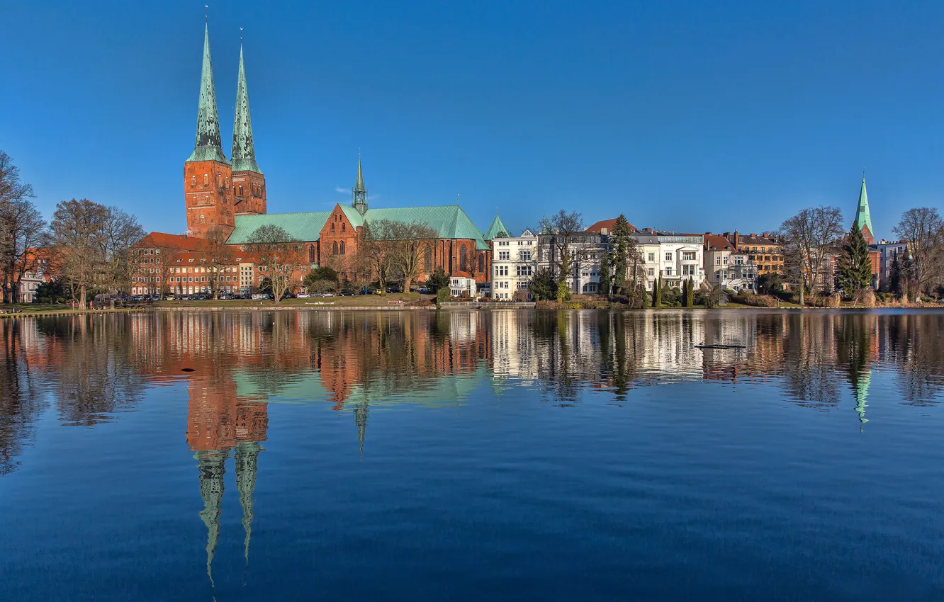 Photo wallpaper the sky, reflection, blue, Germany, mirror, Lubeck, Schleswig-Holstein, St. Mary's Church