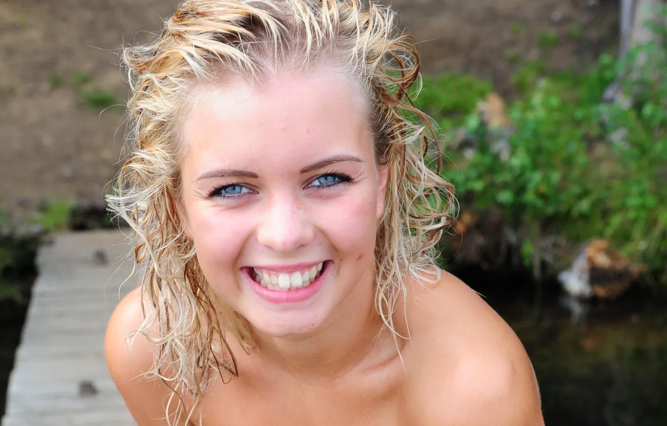 Photo wallpaper girl, grass, river, long hair, nature, smile, water, blue eyes