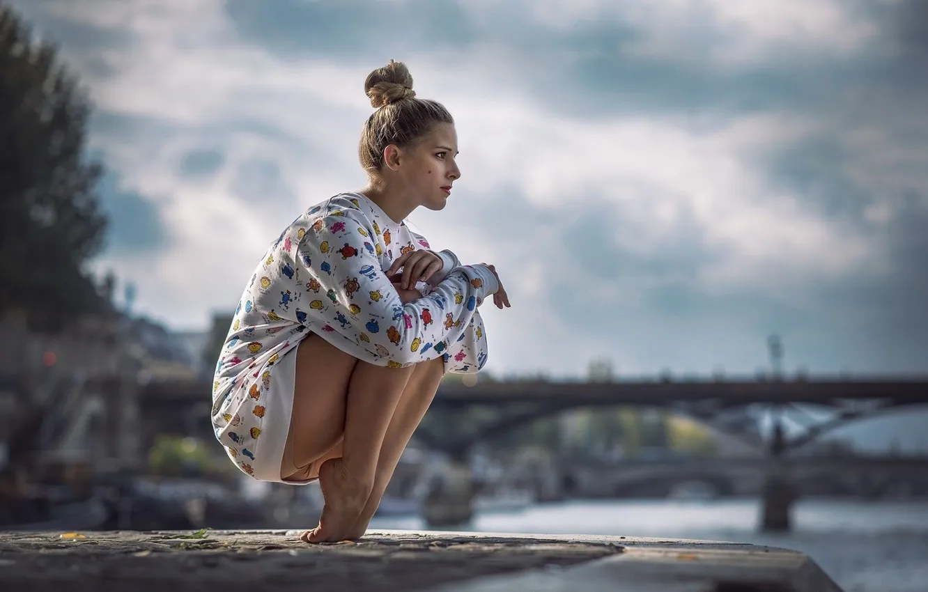 Photo wallpaper girl, clouds, bridge, pose, river, legs, squatting