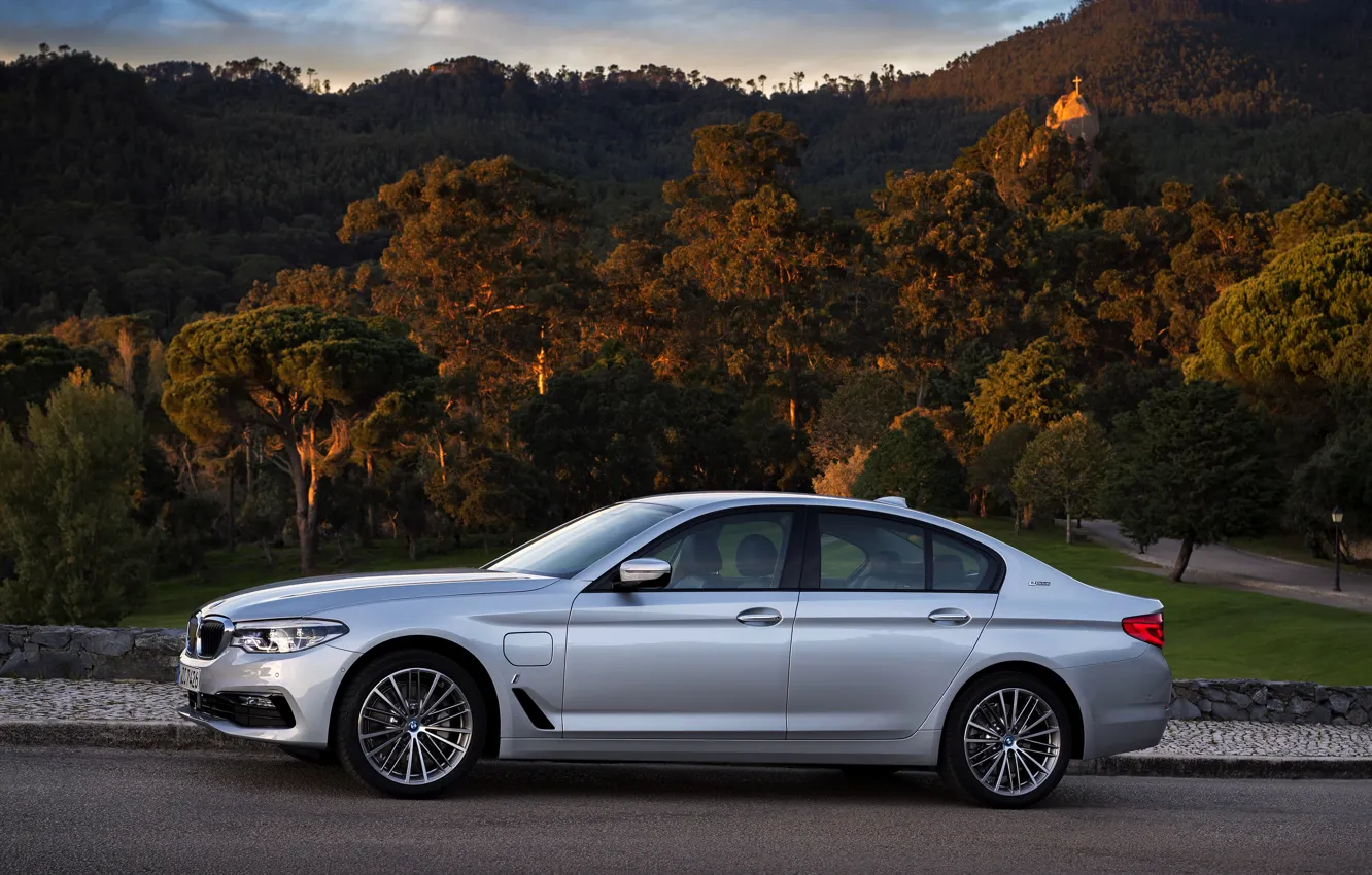 Photo wallpaper road, forest, the sky, clouds, mountains, grey, BMW, sedan