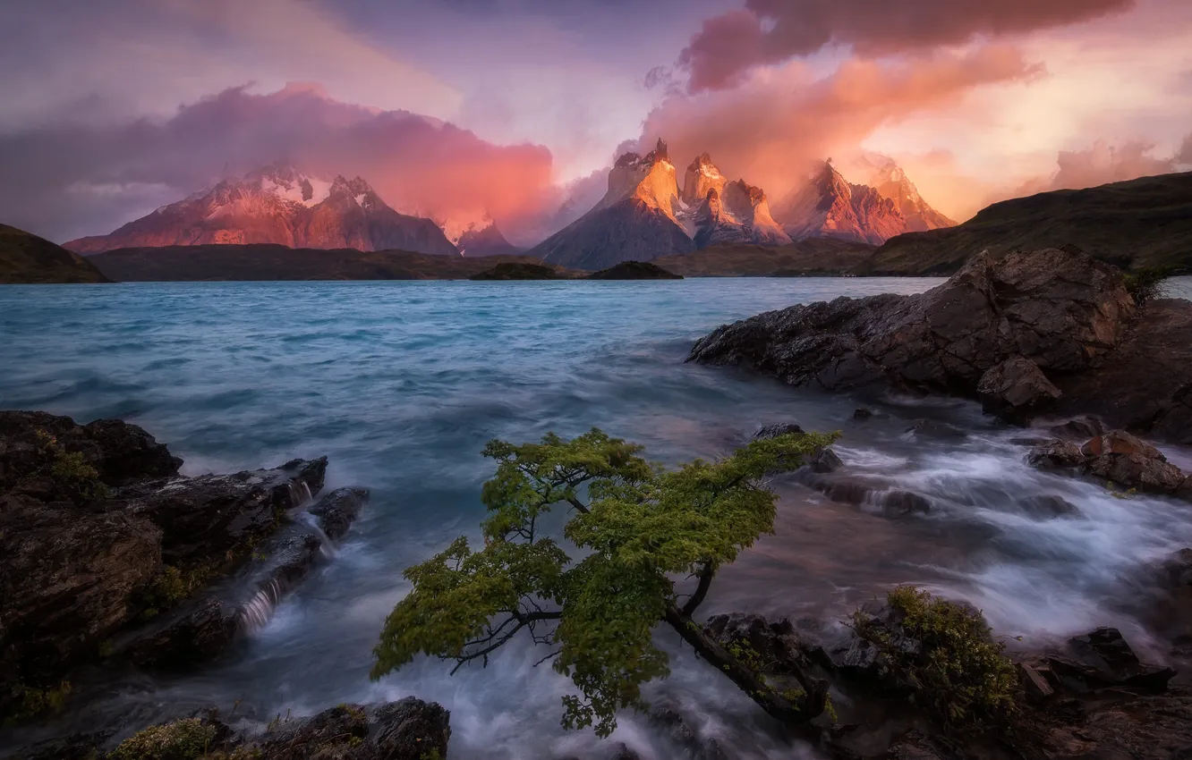Photo wallpaper sea, wave, clouds, light, trees, sunset, mountains, stones