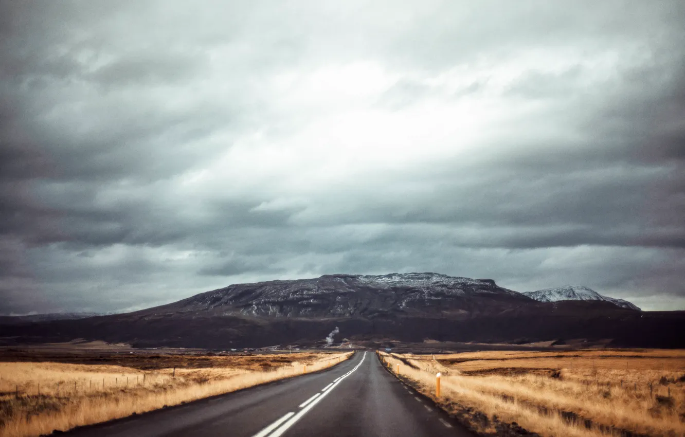 Photo wallpaper road, field, mountains, gray clouds