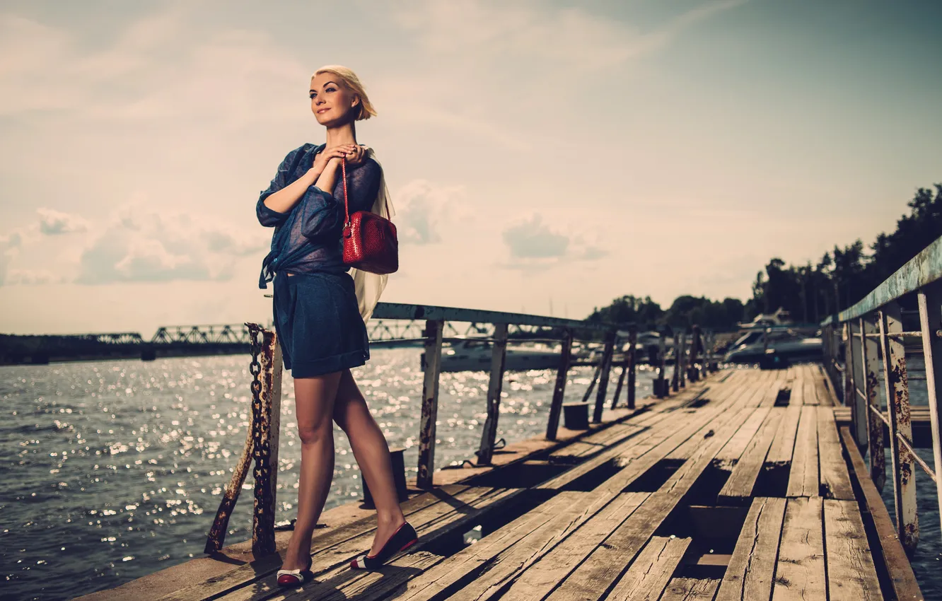 Photo wallpaper girl, bridge, smile, river, pier, blonde, handbag