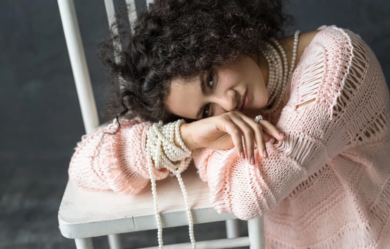 Photo wallpaper look, girl, portrait, brunette, chair, beads, grey background, curls