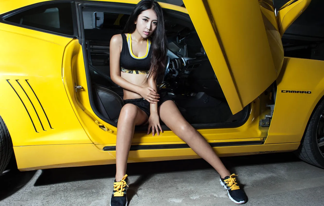 Photo wallpaper look, girl, Chevrolet, Asian, beautiful girl, yellow car, posing in the doorway of the machine