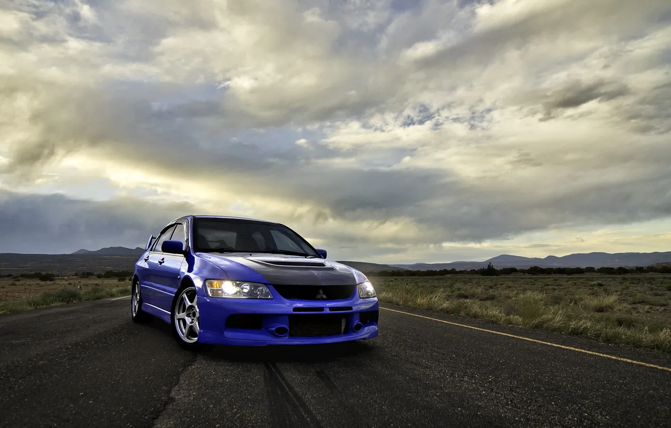 Photo wallpaper road, clouds, blue, front view, mitsubishi, blue, Mitsubishi, Lancer evolution