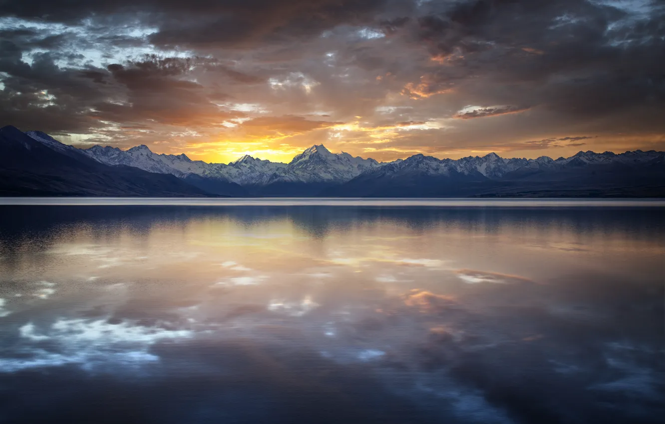 Photo wallpaper sunset, mountains, clouds, lake, surface, reflection, rocks, ridge