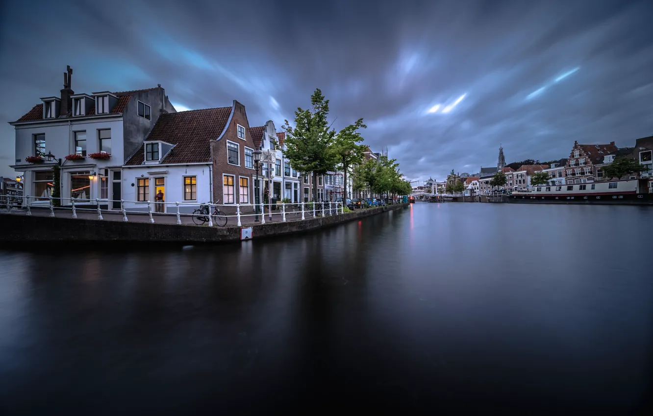 Photo wallpaper the city, river, home, Netherlands, twilight, Haarlem, The guy near