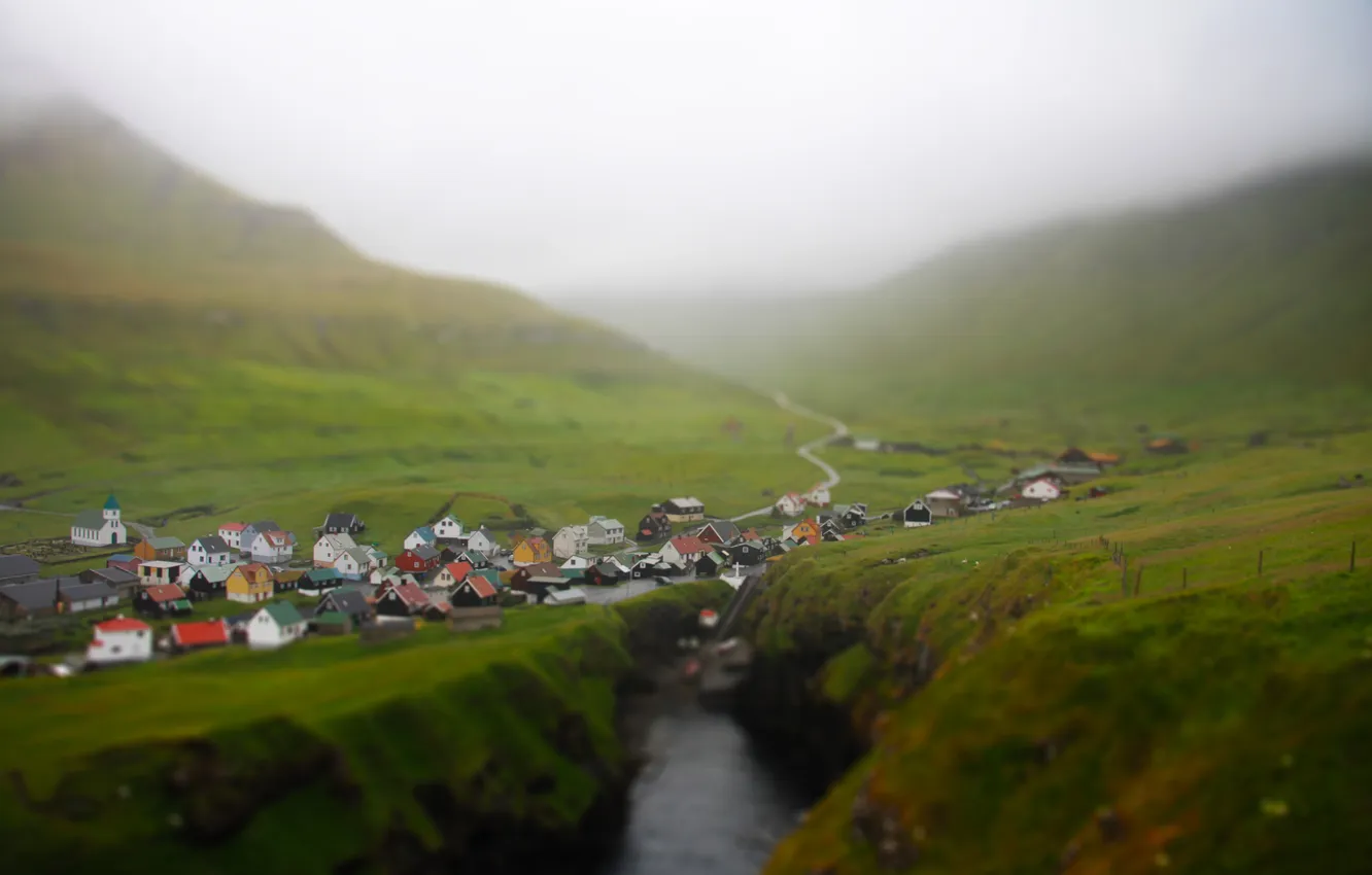 Photo wallpaper mountains, fog, village, tilt shift