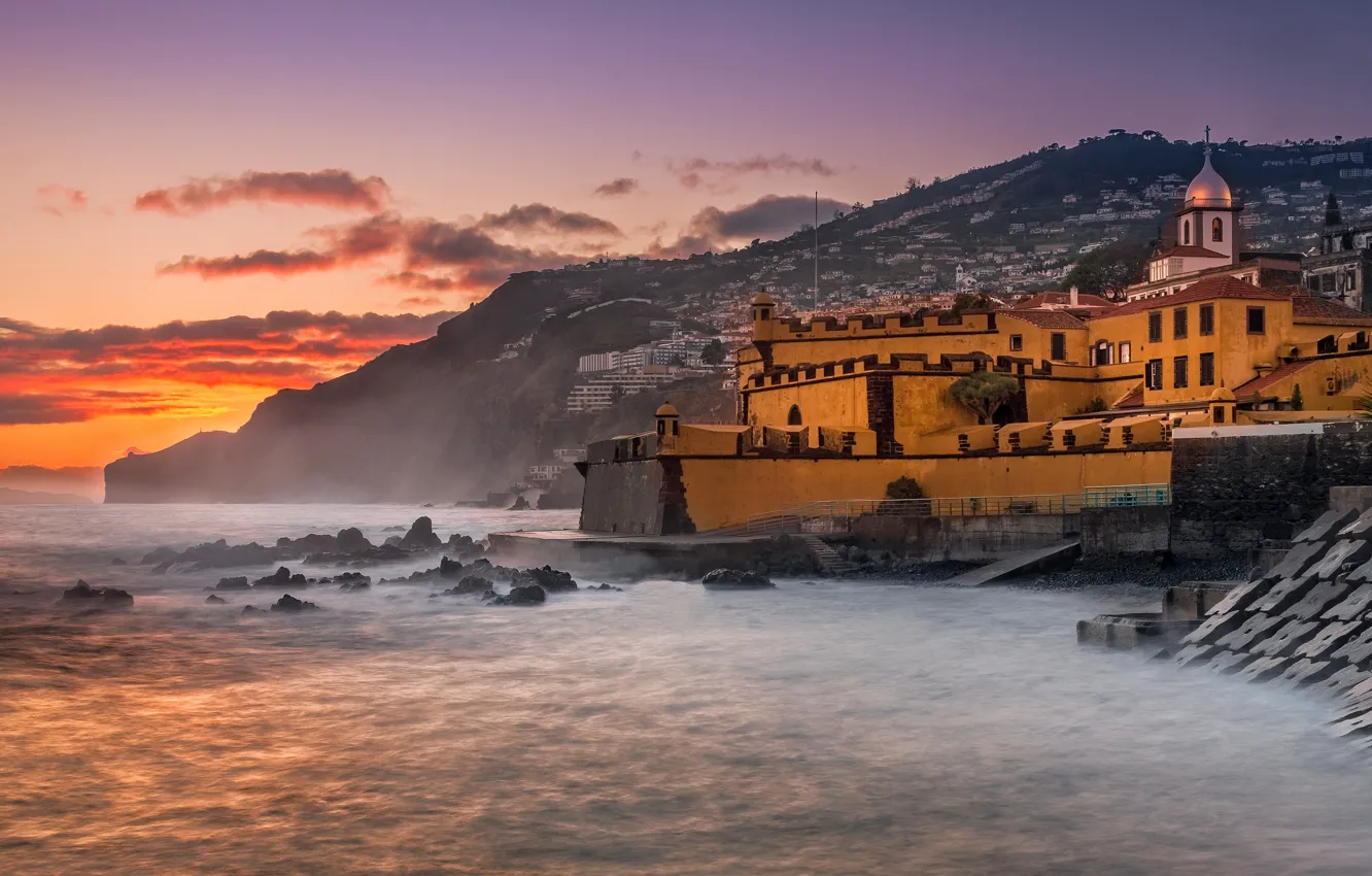 Photo wallpaper sea, the sky, clouds, sunset, mountains, the city, fog, stones