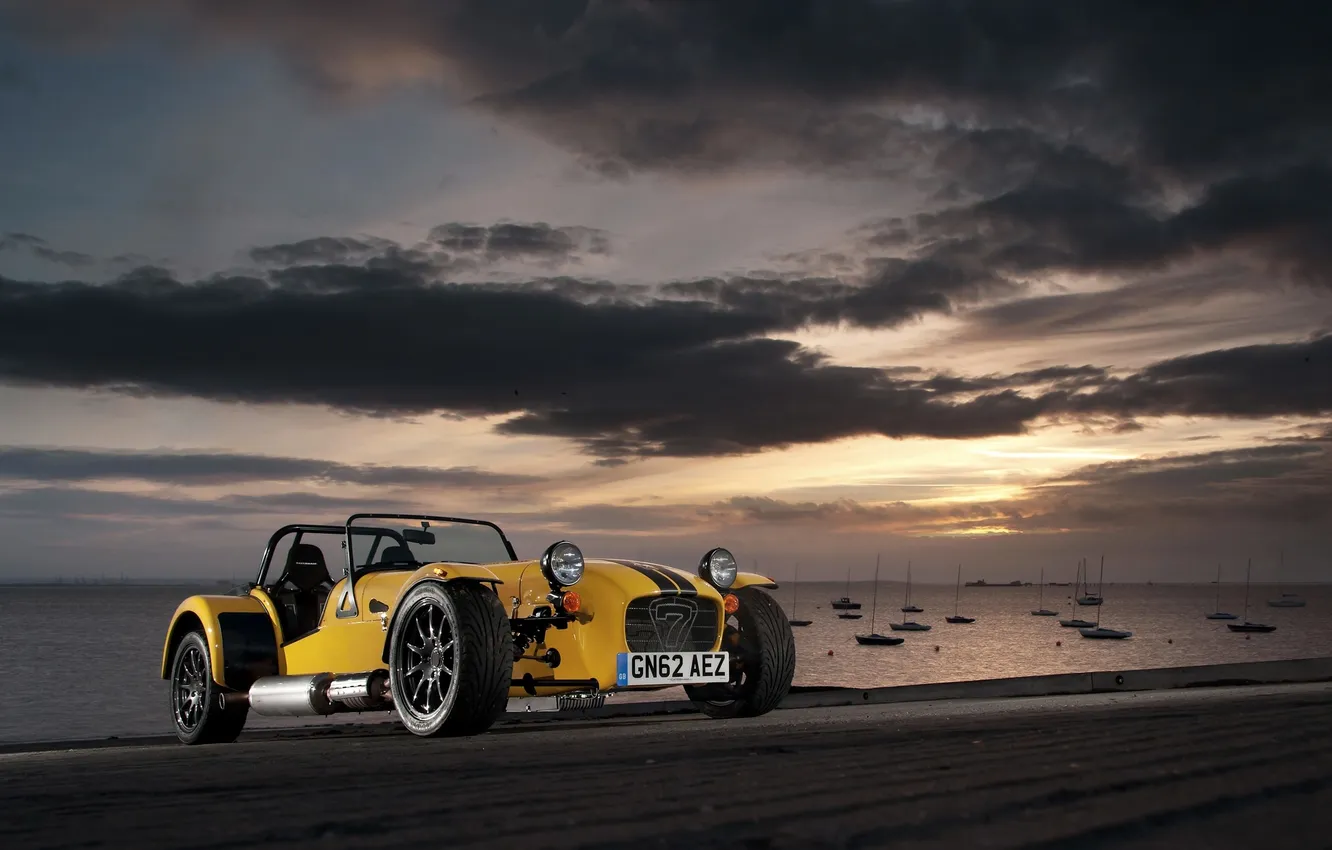 Photo wallpaper sea, auto, the sky, clouds, sunset, yellow, yacht, Caterham