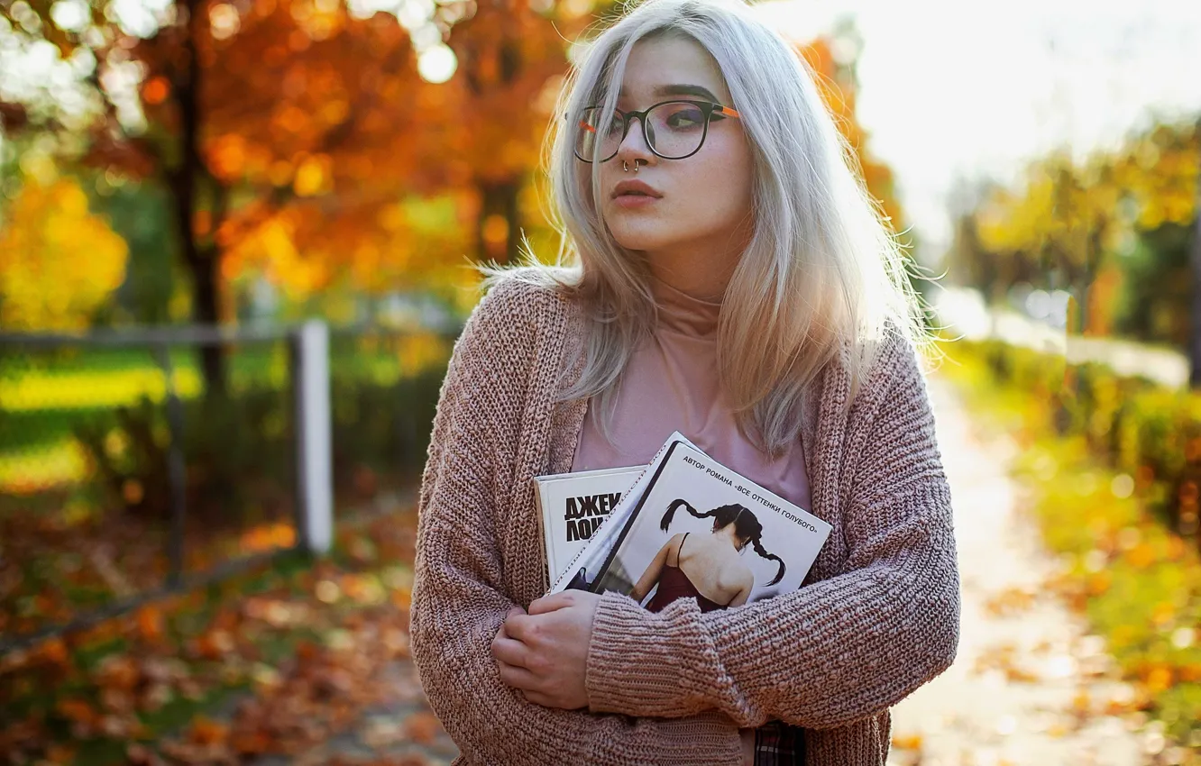 Photo wallpaper autumn, girl, face, hair, piercing, glasses, book, jacket