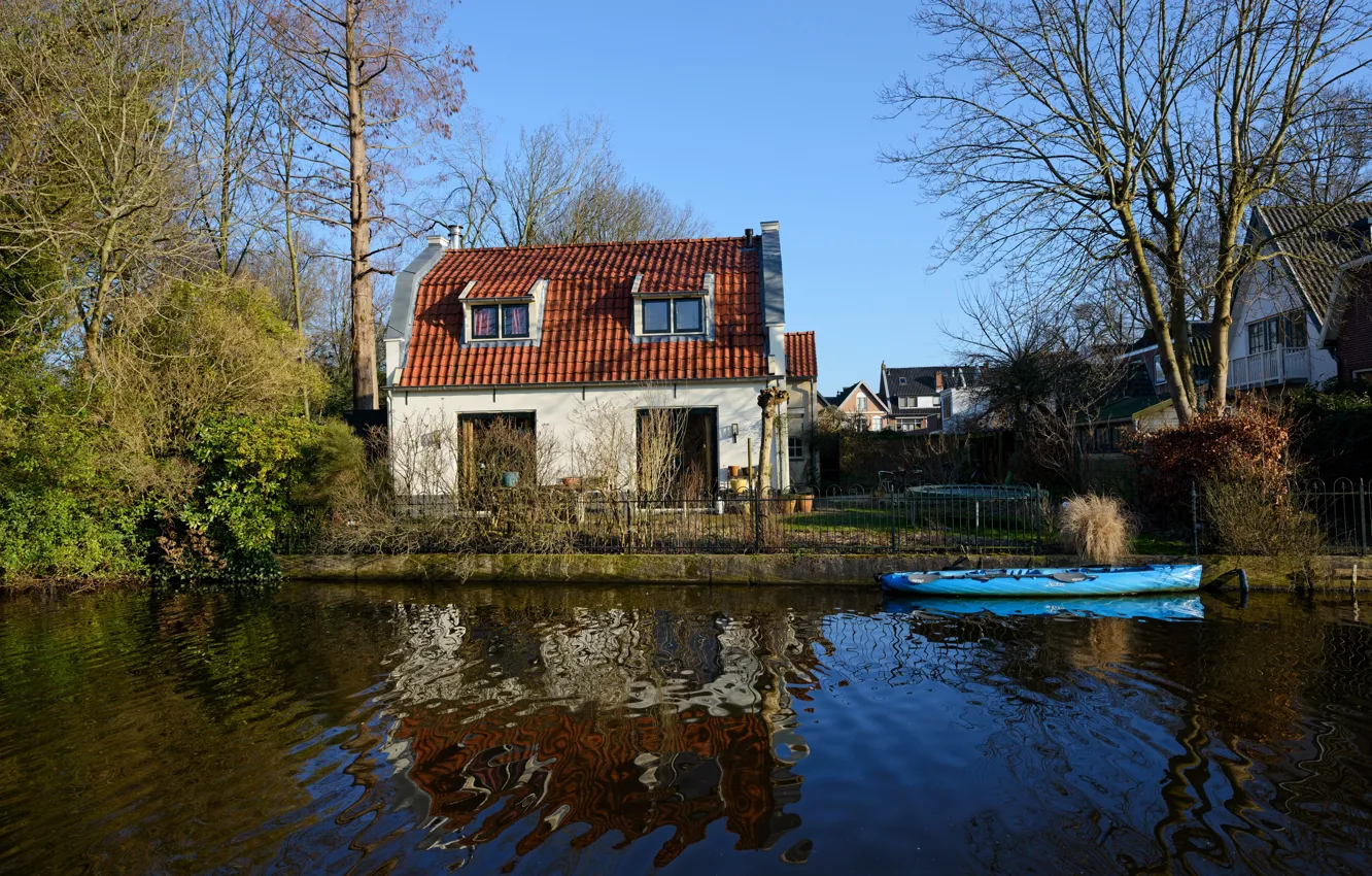 Photo wallpaper the sky, the sun, trees, boat, the fence, home, river, Netherlands