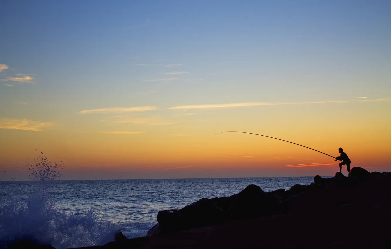 Photo wallpaper sea, wave, clouds, sunset, squirt, stone, fisherman, horizon