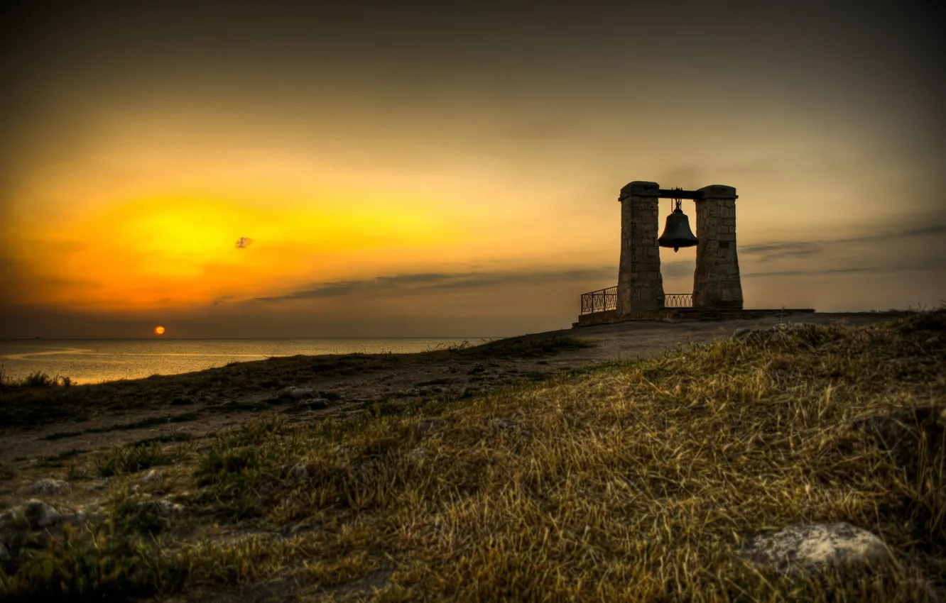 Photo wallpaper sea, the sky, grass, sunset, coast, slope, horizon, bell