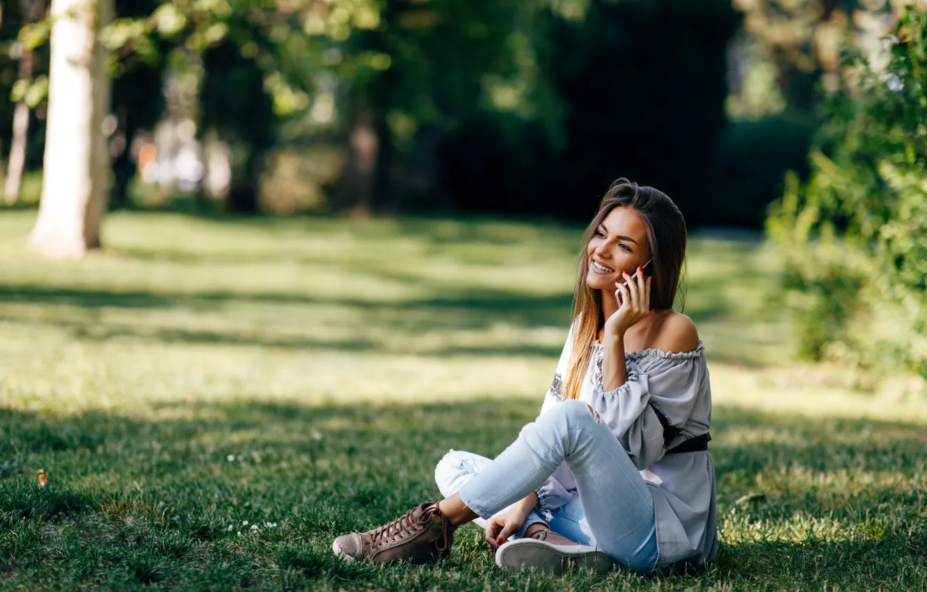 Photo wallpaper grass, girl, pose, smile, Park, blouse, phone, beautiful