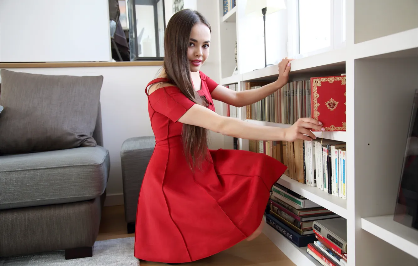 Photo wallpaper hot girl, living room, lamp, red lips, books, pillow, mirror on the wall, posing