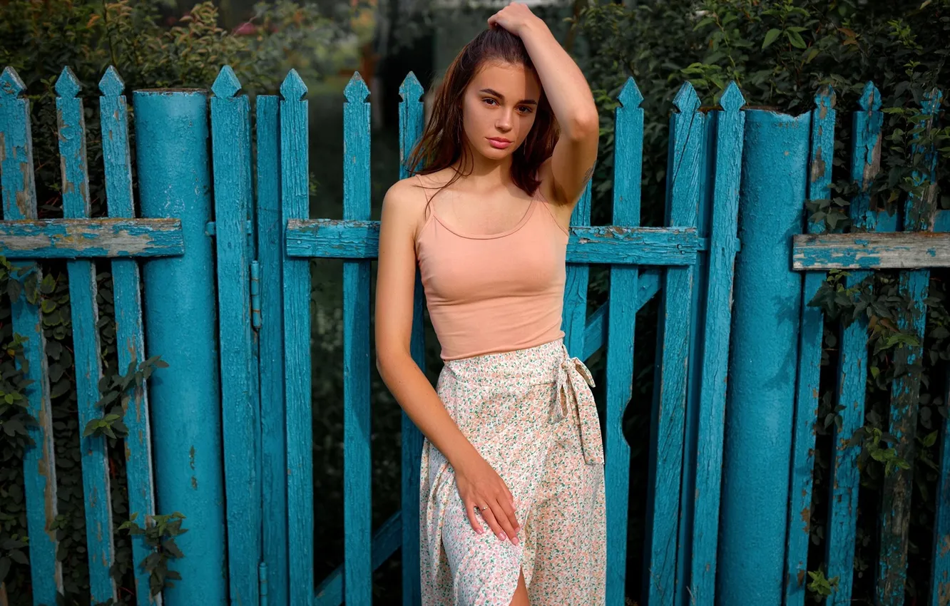 Photo wallpaper girl, model, tattoo, face, brunette, plants, skirt, looking at viewer