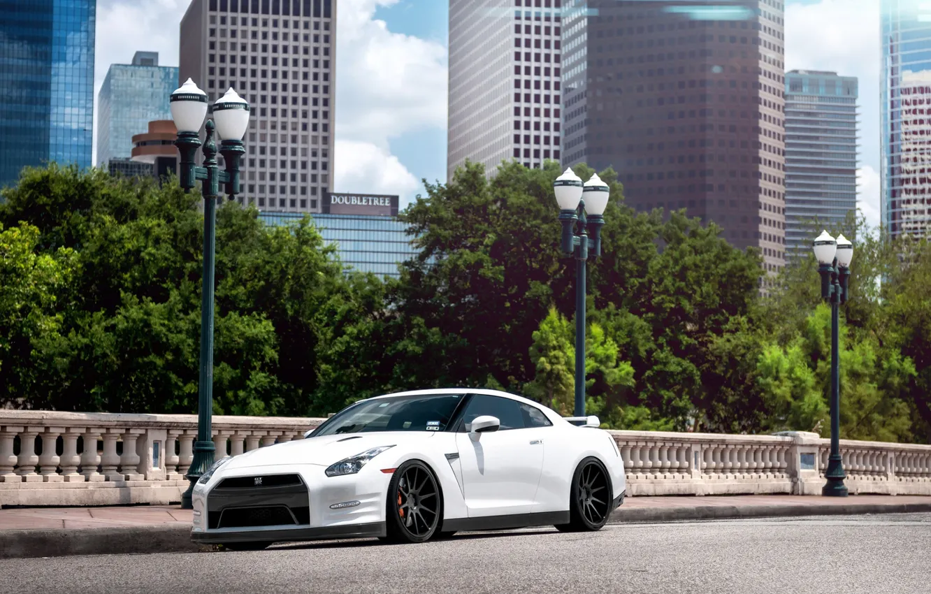 Photo wallpaper road, white, the sky, trees, skyscrapers, lights, supercar, Nissan