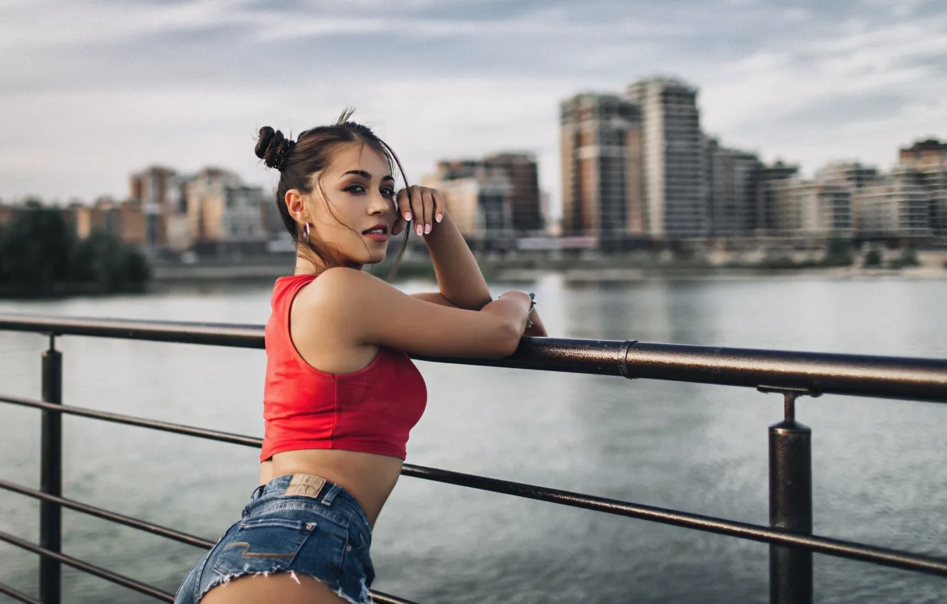 Photo wallpaper look, girl, red, bridge, the city, pose, river, shorts