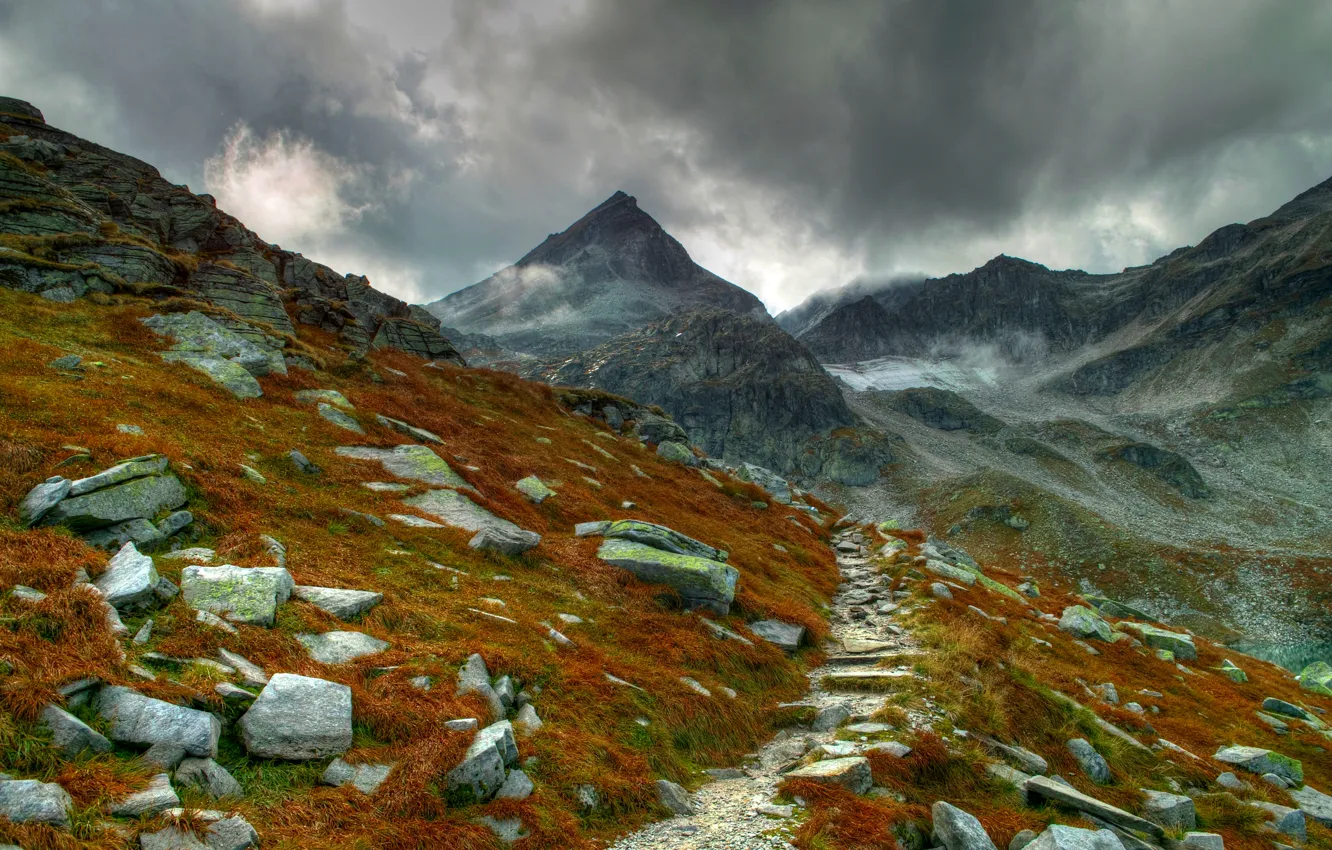 Photo wallpaper grass, clouds, mountains, stones, moss, trail, chain, mountain