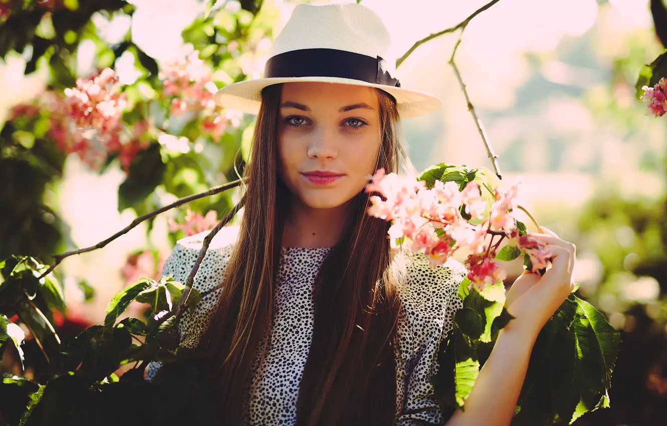 Photo wallpaper girl, flowers, branches, nature, hat, brunette