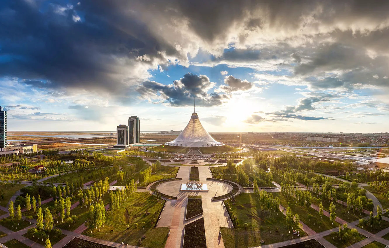 Photo wallpaper the sky, clouds, trees, Park, home, skyscrapers, Kazakhstan, Astana