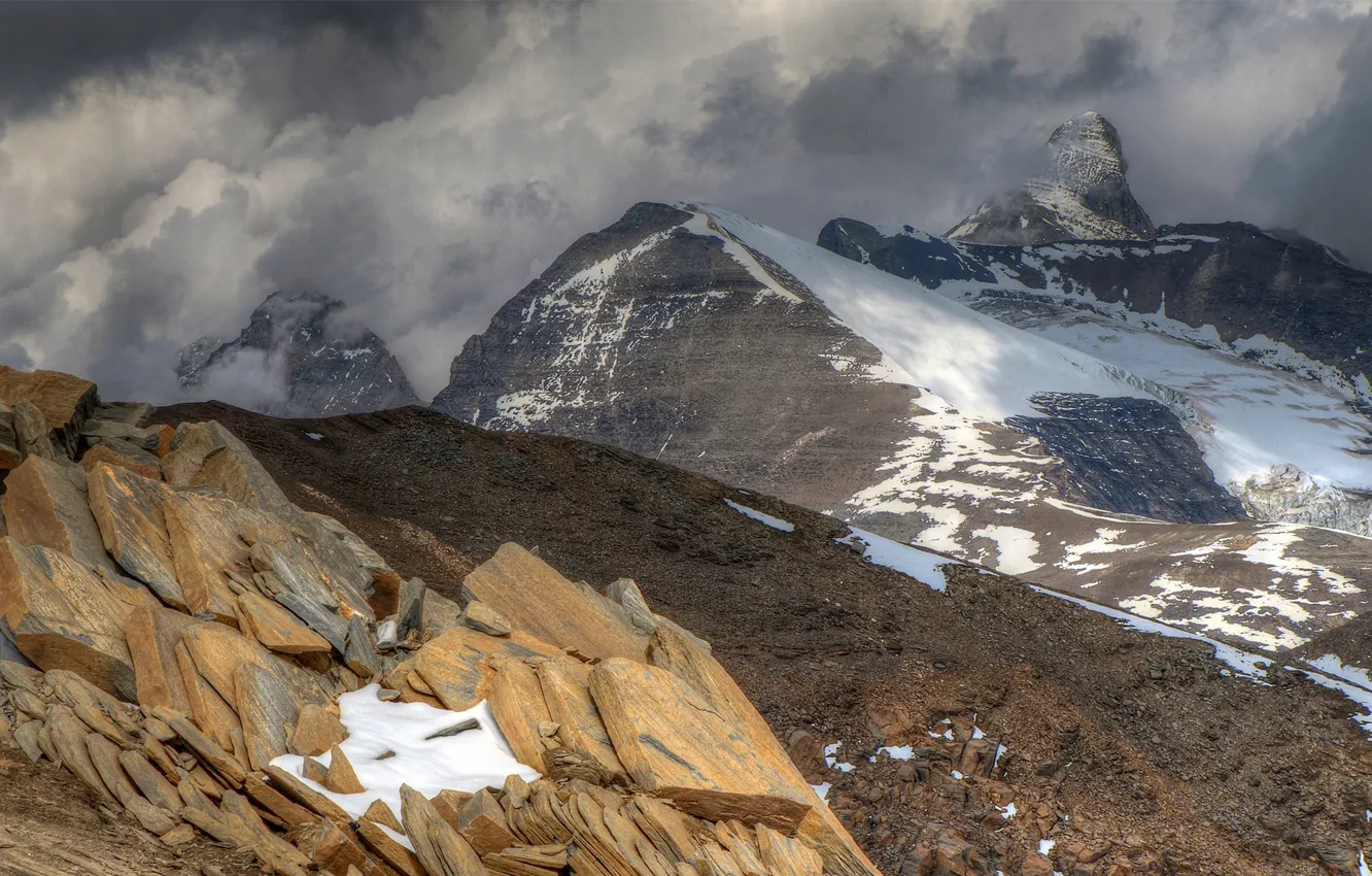 Photo wallpaper clouds, snow, mountains, stones, overcast, rocks