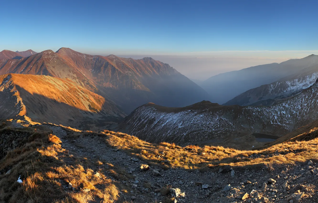 Photo wallpaper grass, snow, mountains, stones