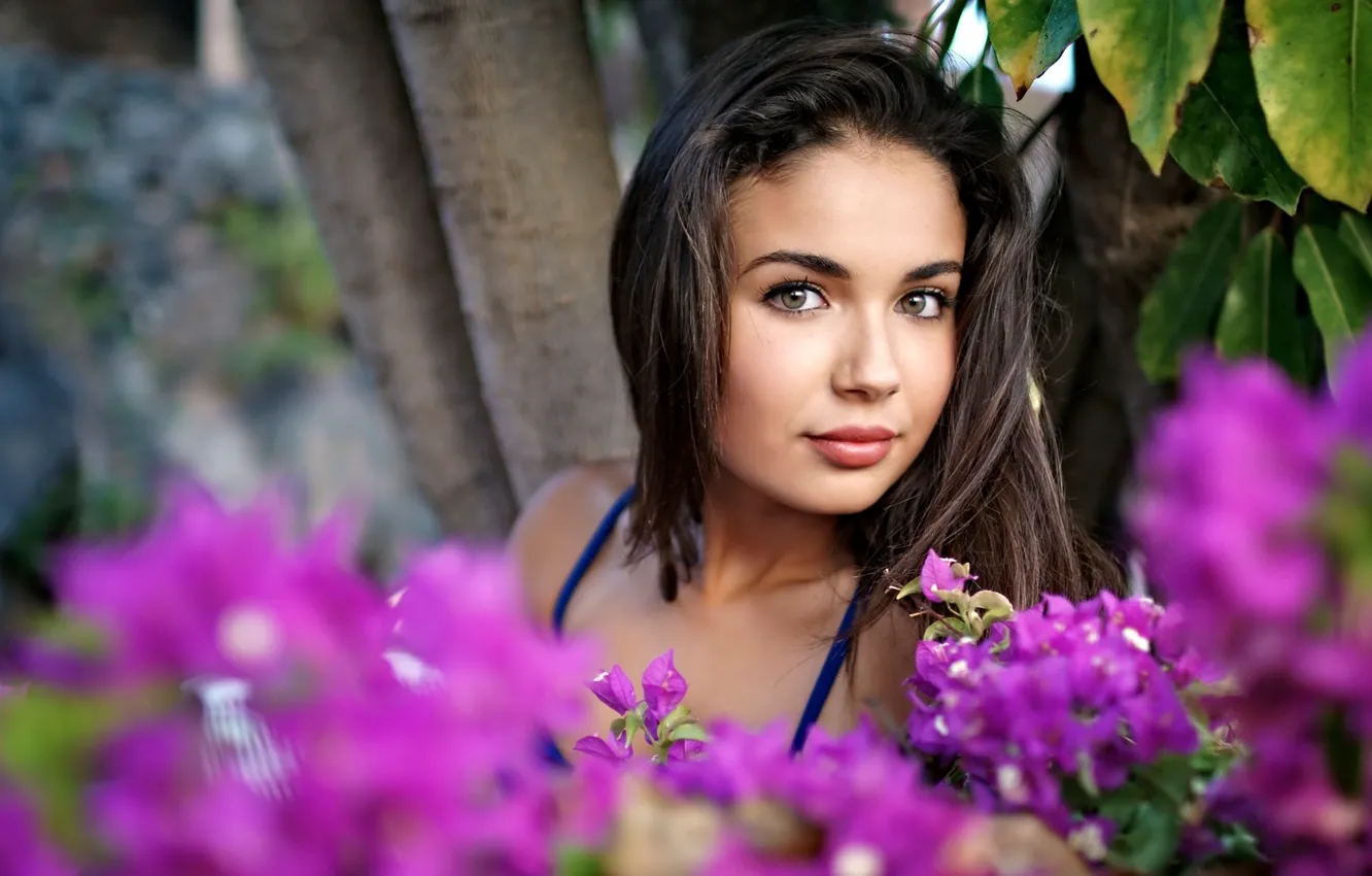 Photo wallpaper leaves, girl, trees, flowers, face, brunette