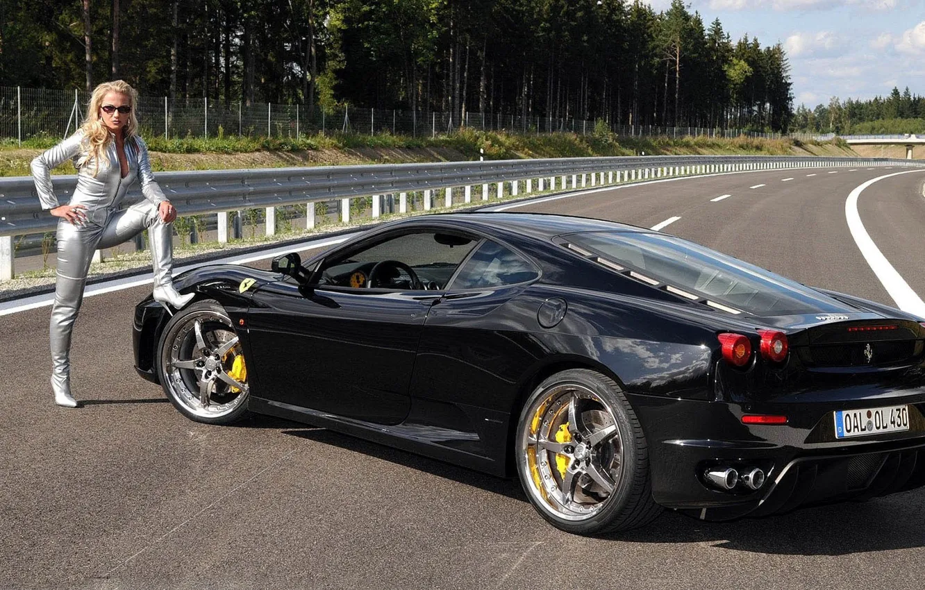 Photo wallpaper girl, blonde, beautiful girl, Standing near the black cars Ferrari, leg on the wheel, on …