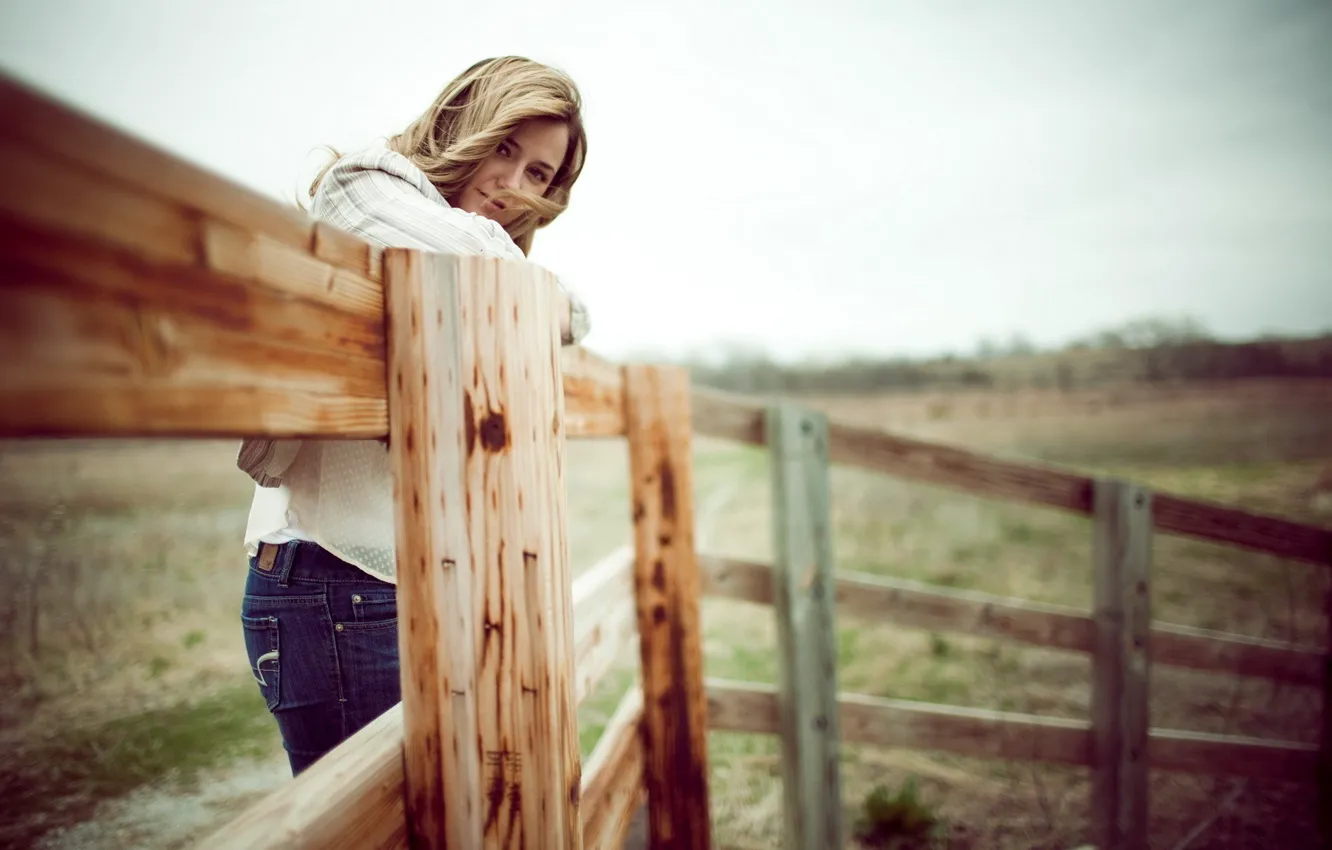 Photo wallpaper field, girl, the wind, hair, the fence, jeans