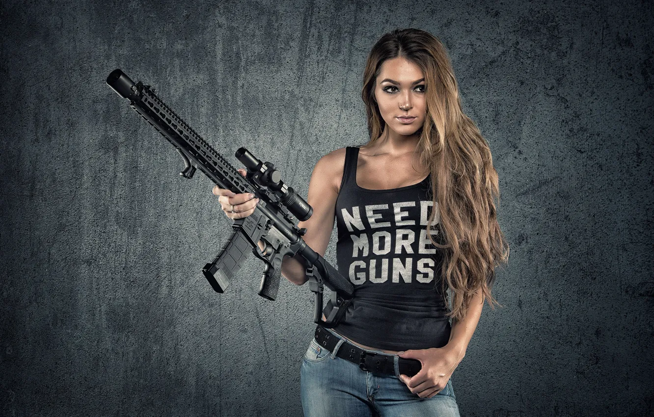 Photo wallpaper girl, face, weapons, background, hair, jeans, figure, machine