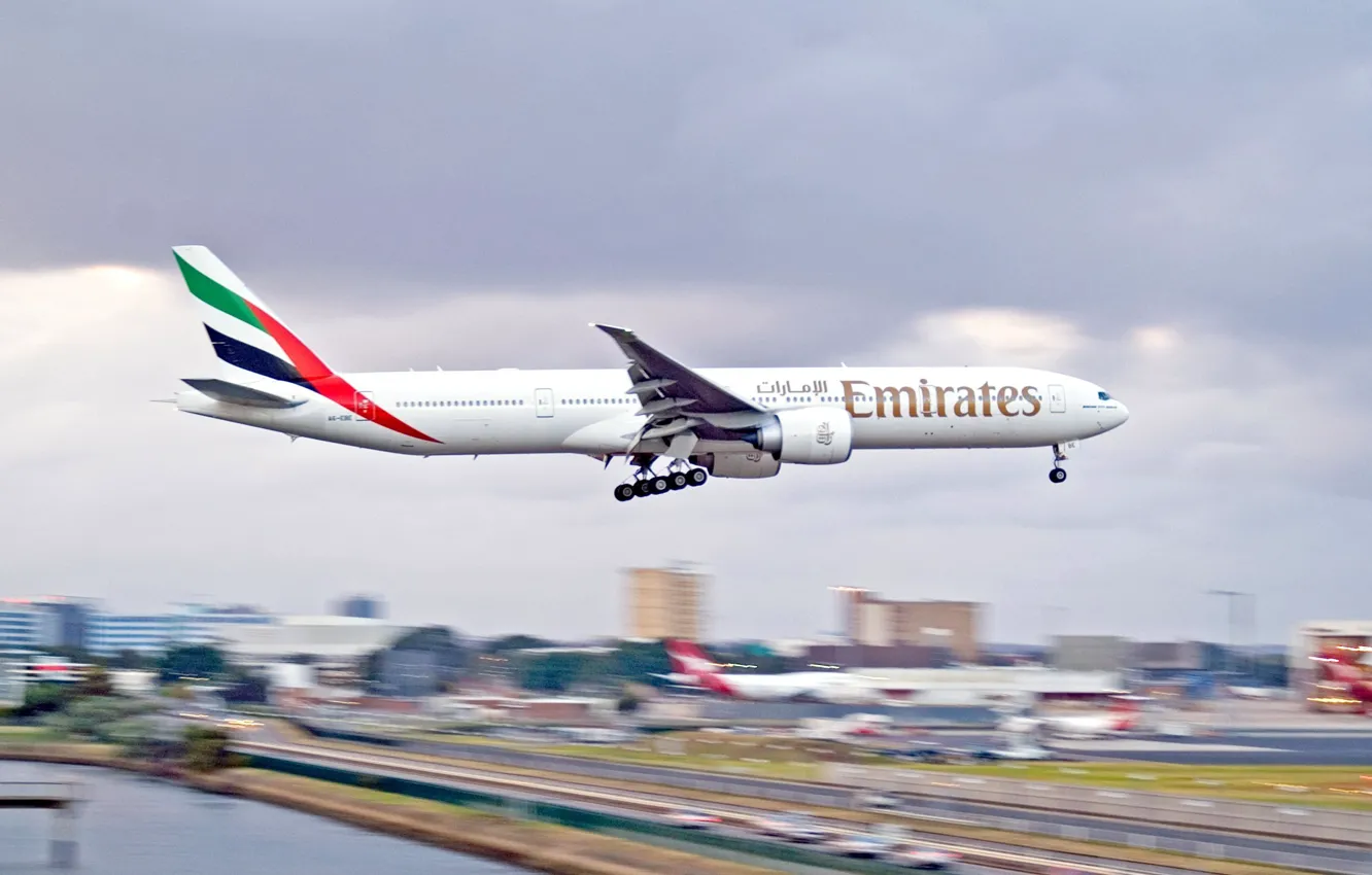 Photo wallpaper the city, airport, Boeing, the plane, landing, Emirates, 300, 777