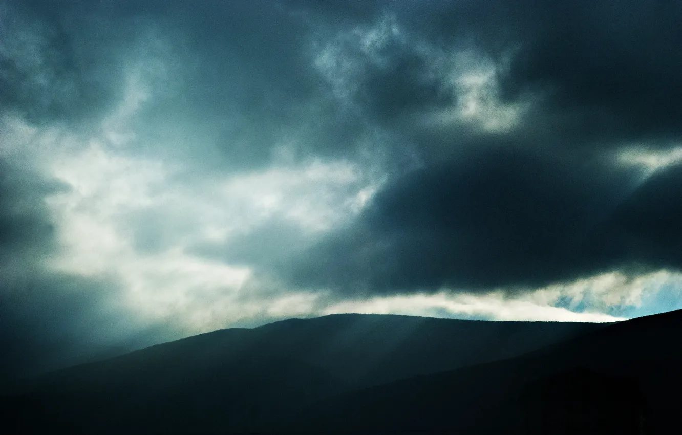 Photo wallpaper landscape, mountains, clouds, darkness, a beam of light